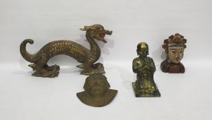 Metal figure of a praying Buddha, 25cm high, a balsa wood carved model of a dragon, a brass mask