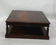 20th century mahogany square two tier coffee table 102 x 42 cms and a red painted reclining chair (