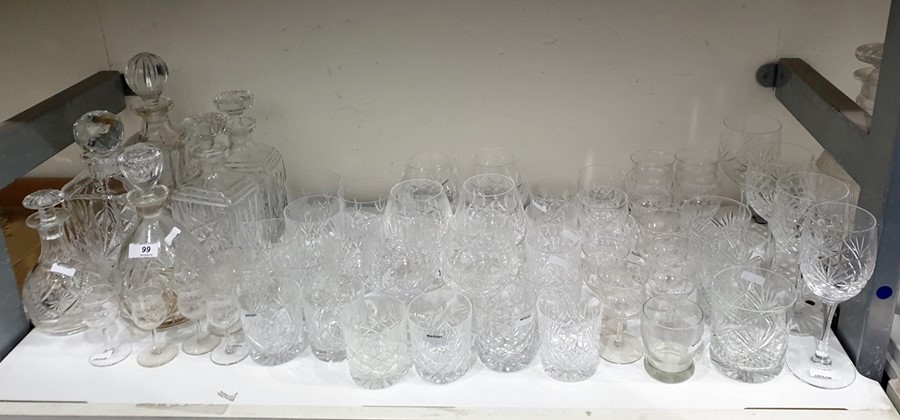 Six various cut glass decanters and a large quantity of cut drinking glasses to include goblets,