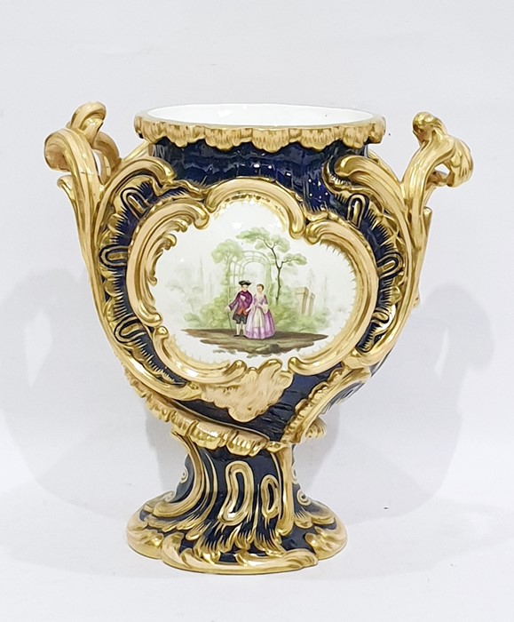 English porcelain blue ground two-handled rocaille moulded vase, mid 19th century, painted with