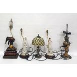 Quantity of table lamps including faux-books on a stand with a resin elephant balancing on a