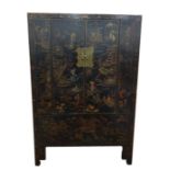 Antique Chinese two-door marriage chest, lacquer decorated on a black ground with assorted figures