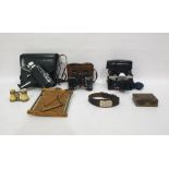 Bell & Howell Auto Load Cine Camera in leather carry case, a pair of binoculars, a Pentagon