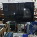 Toshiba 40 inch HD TV, model no. 40L1333DB and glass television stand