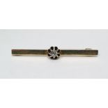 Gold-coloured metal and diamond bar brooch, the old cut diamond in raised claw setting