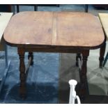 Early 20th century Majik dining table by Lignum, the draw-leaf table raised on baluster turned