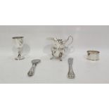 Silver cream jug with cut card borders, raised on paw feet, Birmingham 1905, height 10cm, 4oz