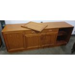 Mid twentieth century G-Plan teak sideboard with central drawer above two cupboard doors flanked