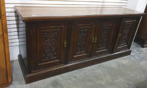 Early 20th century oak sideboard, the rectangular top with moulded edge above four panelled cupboard