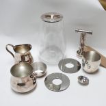 A collection of Christofle silver plated items, to include a Christofle Massaud glass container with