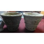 Two reconstituted stone planters of tapered form, decorated with floral swags, H.49cm Diameter