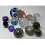 A collection of 16 various signed art glass paperweights