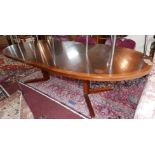 A mid 20th century Danish exotic hardwood dining table, with teak cross banding, stamped 'Heltborg-