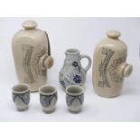 A collection of antique stoneware items, to include two Victorian hot water bottles with black