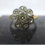 A 1920's 18ct yellow gold old-cut diamond cluster ring, composed of a central diamond surrounded