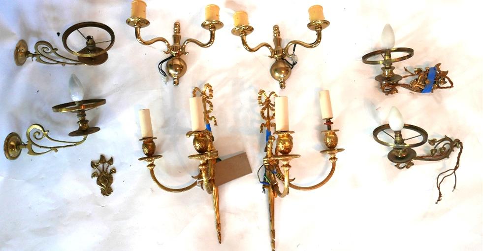 Two pairs of Art Nouveau brass wall lights, together with a pair of Neo Classical style gilt metal