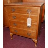 An early 20th century walnut side chest, with four drawers, raised on cabriole legs, H.69 W.55 D.