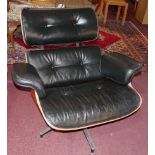 A Charles Eames style swivel lounge chair