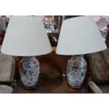 A pair of Chinese porcelain table lamps with floral decoration