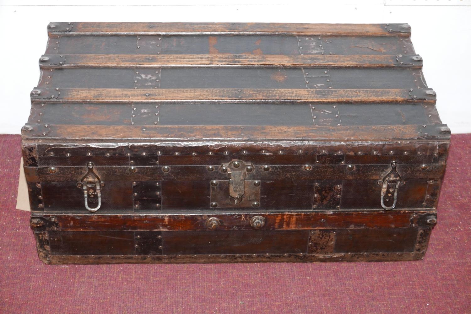 An early 20th century ash and iron bound vintage travelling trunk, H.31 W.78 D.43cm