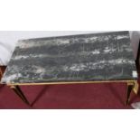 An Adam style marble topped coffee table on gilt and ebonised tapering supports. H.50 L.100cm