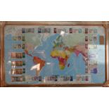 A sporting interest, a map of the world mounted with international currency signed by famous