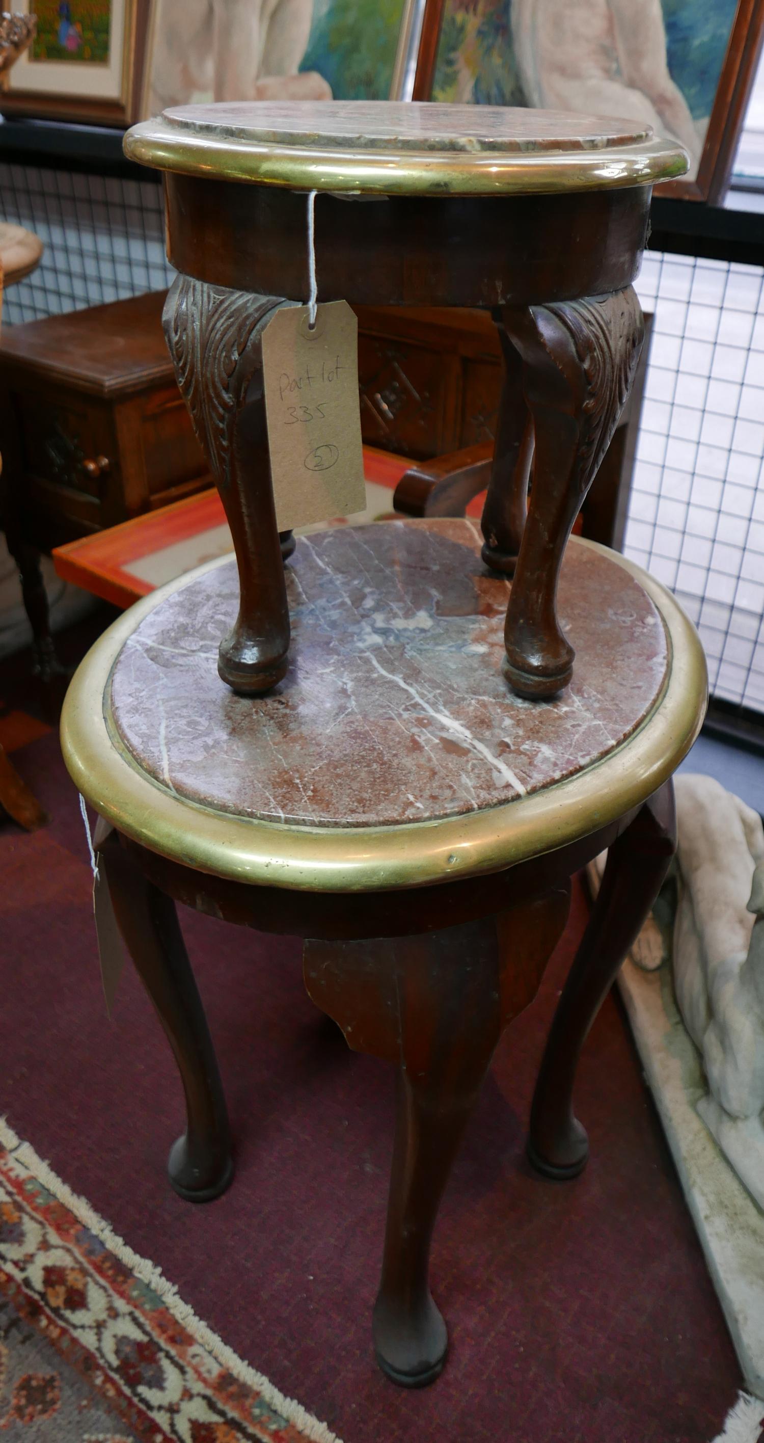 A marble topped oval low table with brass bound top and another smaller circular. largest W.56cm