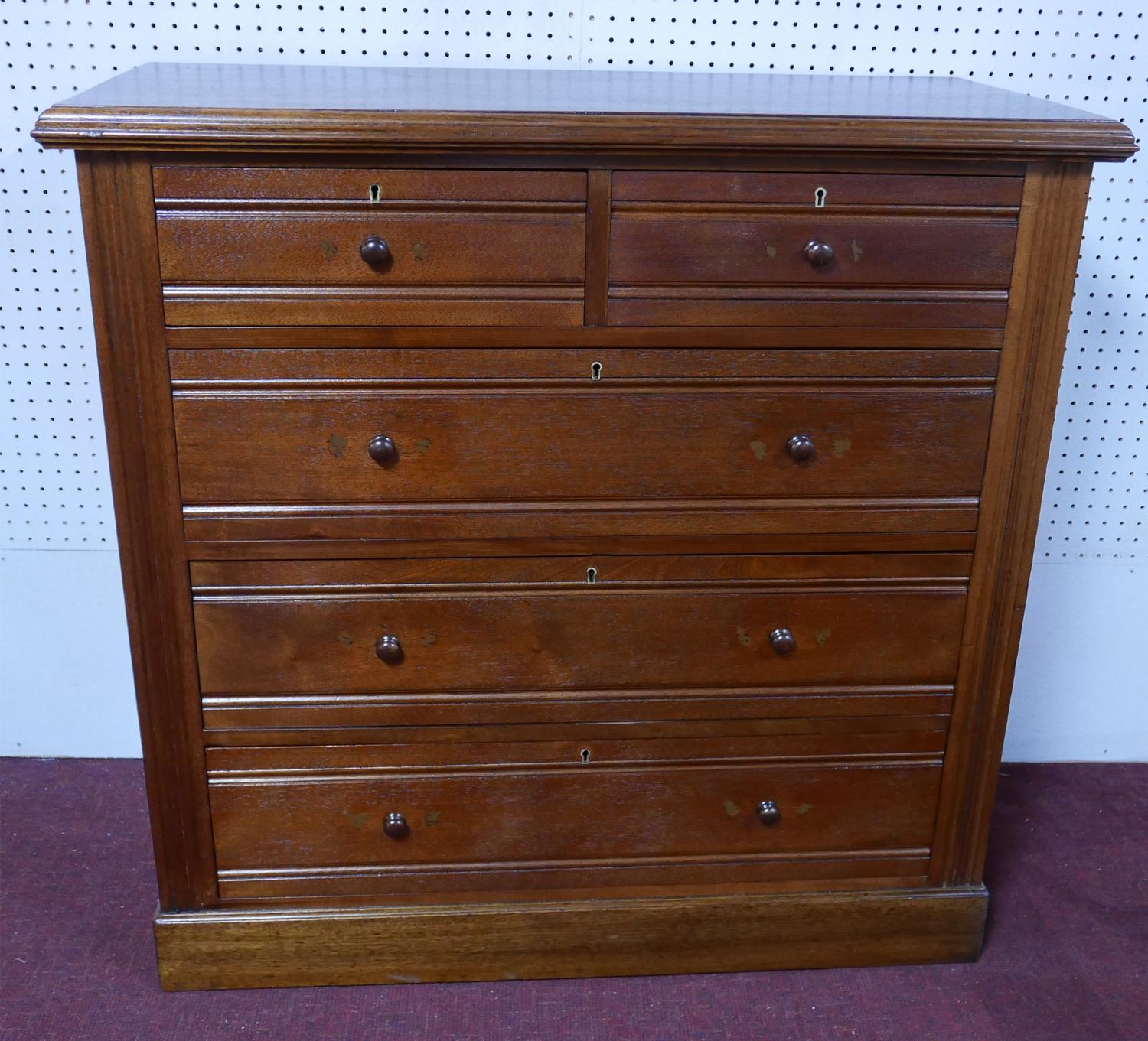 A late Victorian mahogany chest of two short over three long drawers, raised on pedestal base, H.103