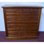 A late Victorian mahogany chest of two short over three long drawers, raised on pedestal base, H.103