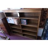 A large early 20th century walnut open bookcase with plinth top and arranged over 10 shelves, 133.