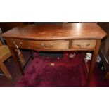 A 19th century mahogany serpentine fronted writing table with three drawers raised on tapered legs