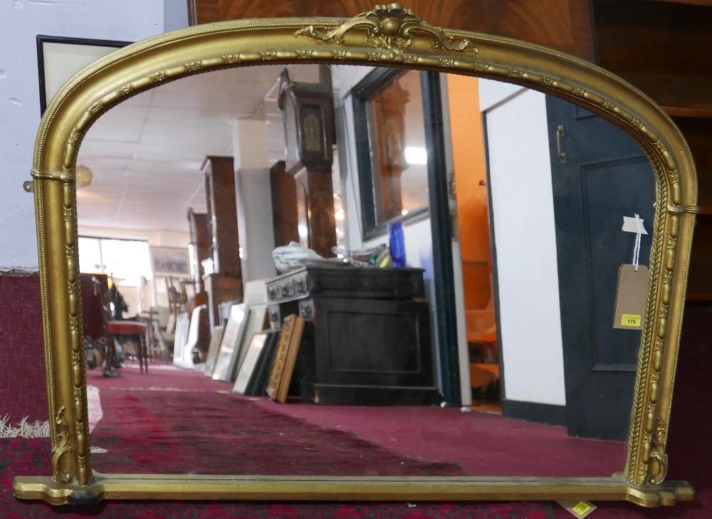 A Victorian style arched gilt overmantel mirror, H.88 W.138cm