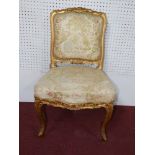 A late 19th / early 20th century Louis XV style side chair, the upholstery decorated with figures