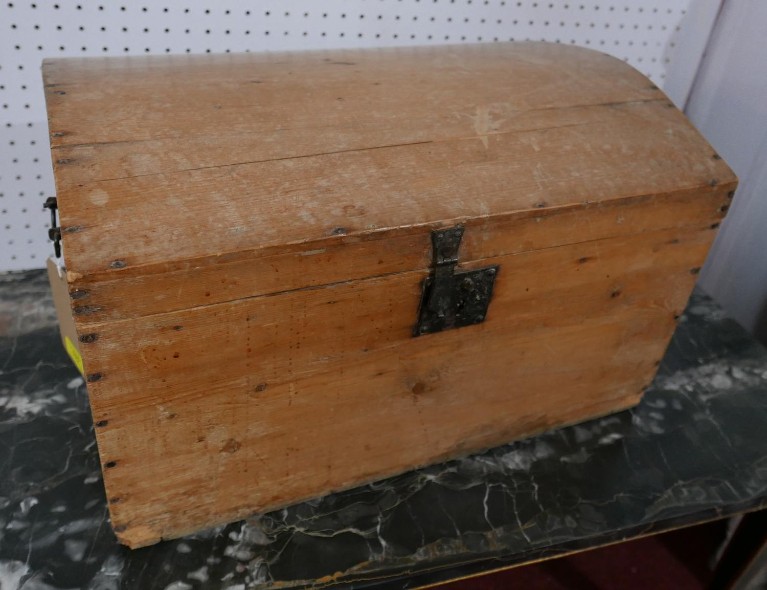 A 19th century Continental pine dome topped trunk, with hinged lid, H.33 W.56 D.38cm