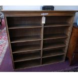 A large early 20th century walnut open bookcase with plinth top and arranged over 10 shelves, 133.