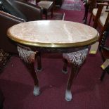 An oval marble topped table with brass bound edges on mahogany cabriole supports H.68 W.75cm