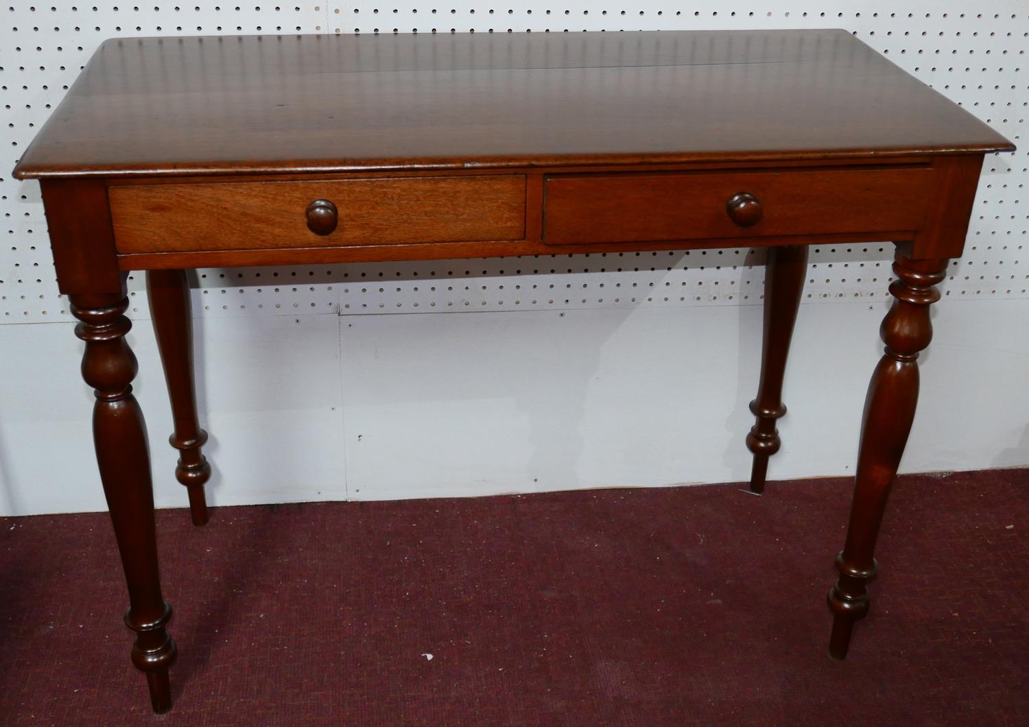 A Victorian mahogany side table, with two drawers, raised on turned legs, H.76 W.100 D.49cm