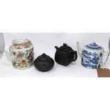 A 19th century Chinese blue and white teapot, together with a famille rose example and with two