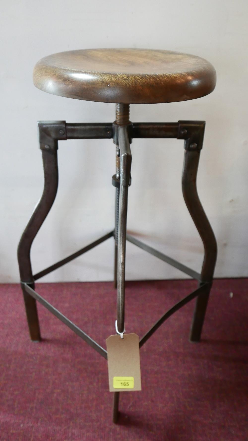 An industrial style adjustable revolving stool