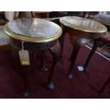 A pair of oval marble topped low tables with brass bound edges on carved mahogany cabriole supports