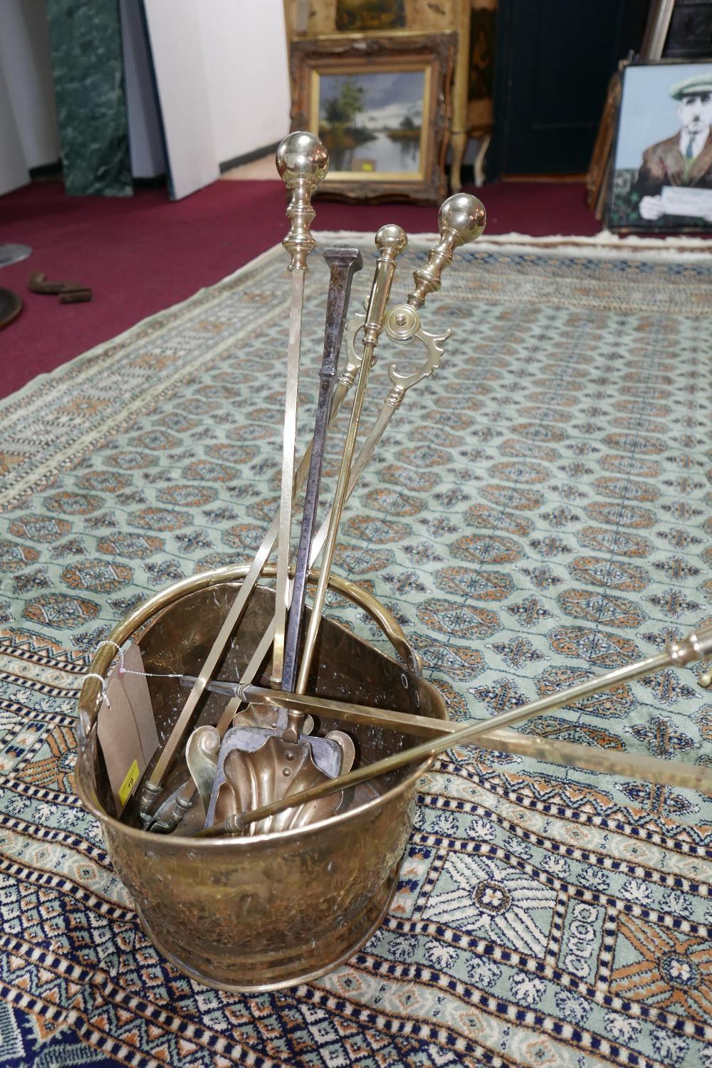 A 19th century brass 'helmet' scuttle, with a selection of fire arms, (6)