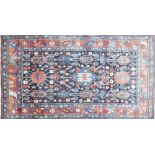 A North West Persian Nahavand rug, central pole medallion with repeating petal motifs on a