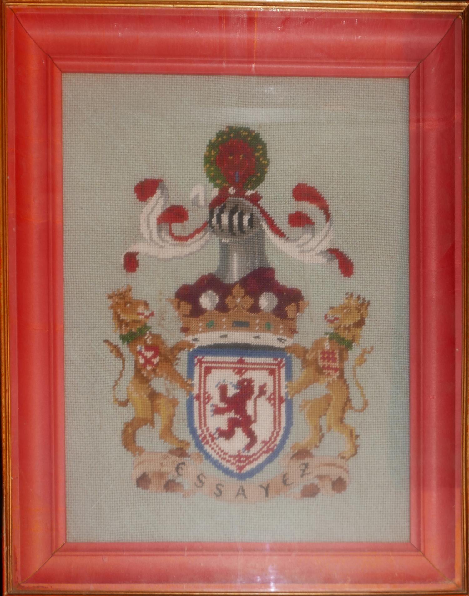 A framed tapestry, coat of arms H.56 W.46cm