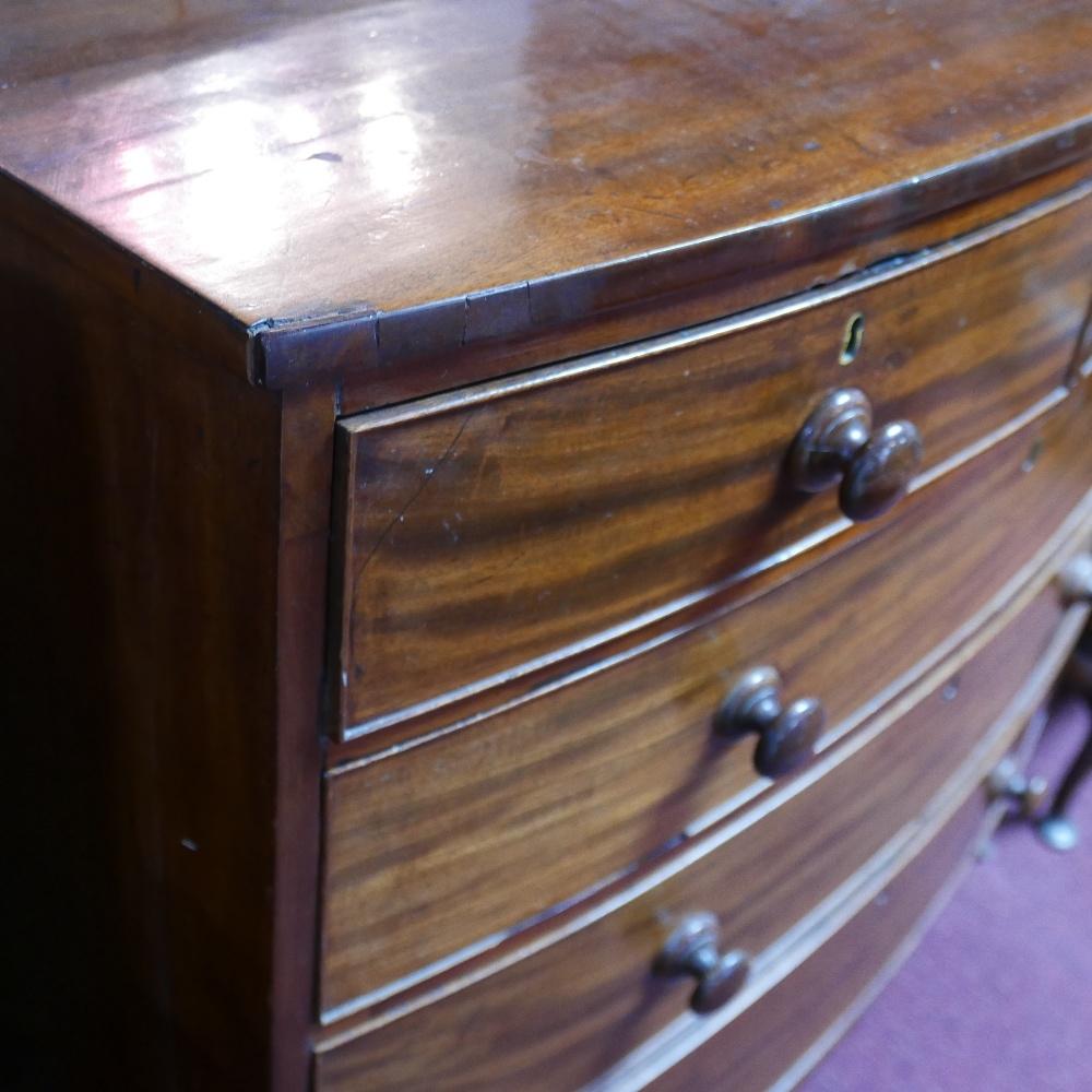 A Georgian mahogany bowfronted chest of two short over three long oak lined drawers on swept feet, - Bild 2 aus 2