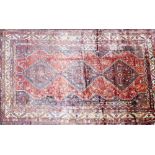 A South West Persian Qashqai carpet, triple pole medallion with repeating petal motifs on a