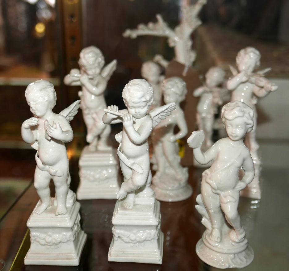 A collection of Capodimonte white glazed cherubs, each playing musical instruments, consisting of - Image 3 of 3