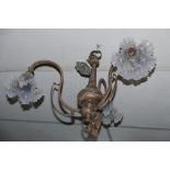An early 20th century silver plated three branch chandelier with Vaseline glass shades