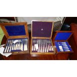 A cased set of Walker & Hall silver forks, hallmarked Sheffield, together with two other cased