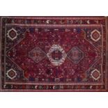 A South West Persian Qashqai carpet, triple pole medallion with repeating petal and animal motifs on