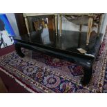 A Chinese black lacquered coffee table, H.44 W.144 D.92cm